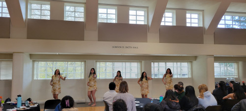 Five Hawai'ian club members performing for Asian, Desi, and Pacific Islander Heritage Month Dinner.