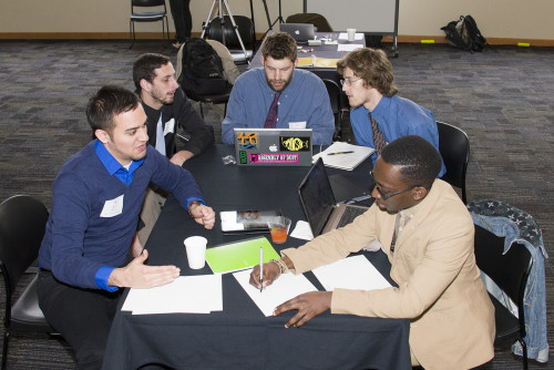 Members of the House of Tayo and Portland Mushroom Company teams participate in a Venture Competition workshop.