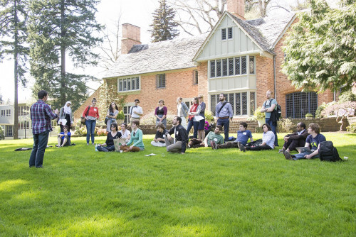 Venture Competition participants prepare their pitches outside the Manor House.