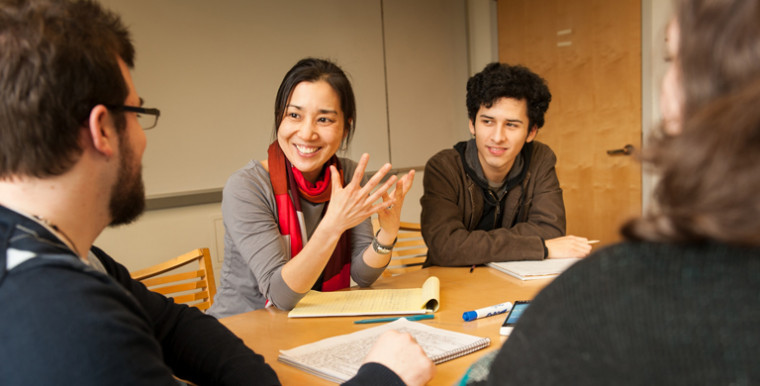 Assistant Professor of English Kristin Fujie meets with students.