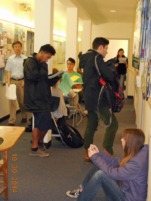 Meanwhile the students doing homework are in the hallway.