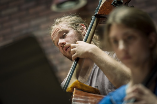 A cellist rehearses with the Lewis & Clark Orchestra