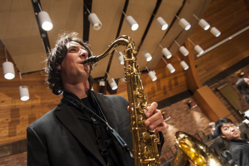 A saxophonist performs with the Lewis & Clark Wind Symphony