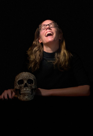 Ritchey poses with a skull as part of the photo session for her book, Composing Capital: Classica...