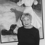 Marion Beals poses in front of one of her own paintings.