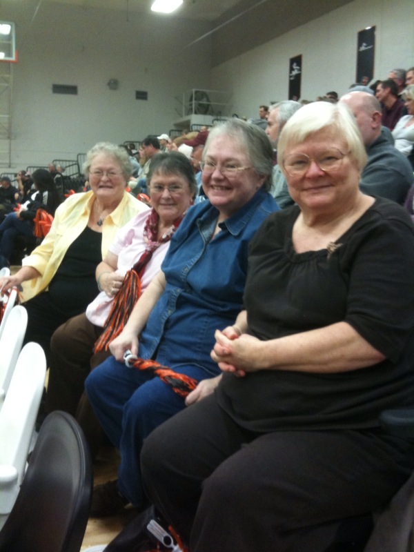 The four sisters in the picture left to right are:  Mary Shearer '62, Judy Shearer Coyne '63, Nona Shearer '74, Margaret Shearer '58