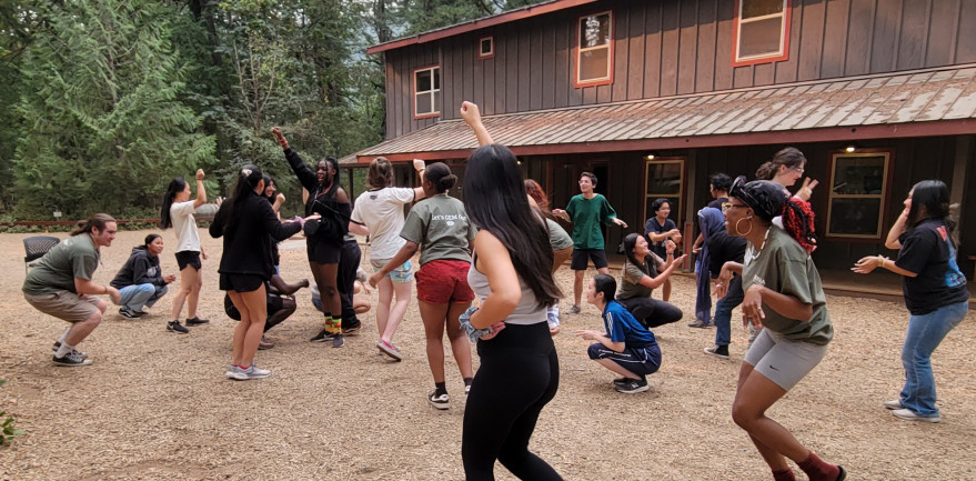 A picture from the 2023 GEM Retreat of students playing outside.