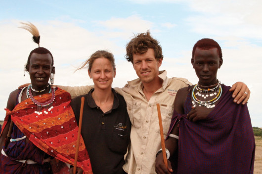 Rebecca Moran and her husband, Ezra Jay, with two Maasai brothers who have become their friends.
