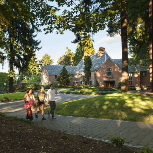 Students walking in front of Frank Manor House.