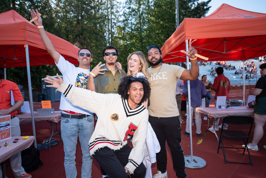 Young Alumni enjoy Tailgate in the End Zone, 2022.