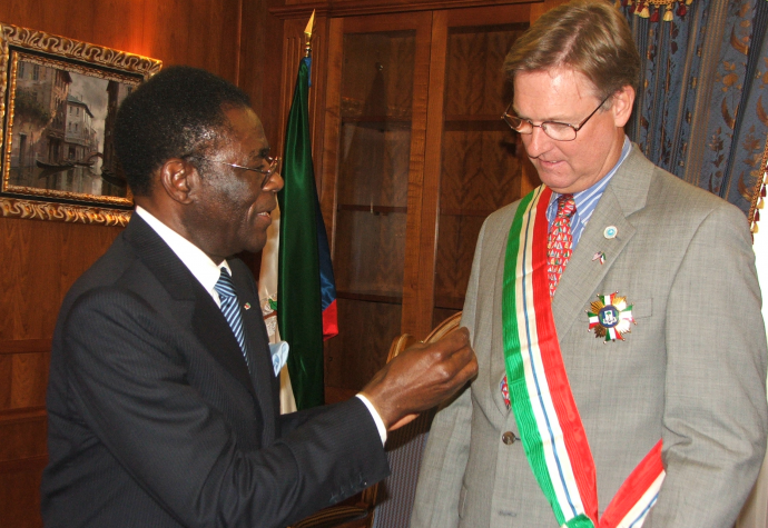 Equatorial Guinean President Teodoro Obiang bestowing his country's Gran Cruz de la Orden de Independencia on Ambassador Marquardt in 200...