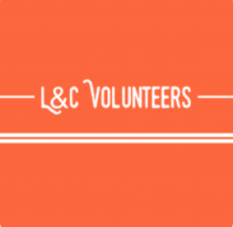 Orange background with white lettering. L&C Volunteers.