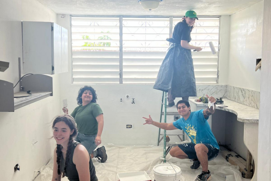 Volunteers Lily, Alex, and Brooke work with SBP to revitalize a community member's house that was damaged by recent hurricanes.