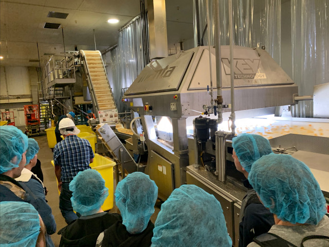 Climate Science students visit Kettle Brand, which produces potato chips and actively engages in sustainability initiatives.  Touring thi...