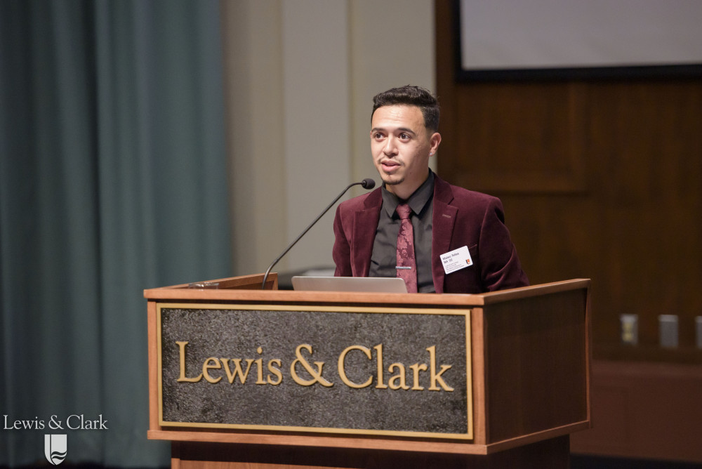 Symposium co-chair Mateo Telles '22 introducing a keynote speaker
