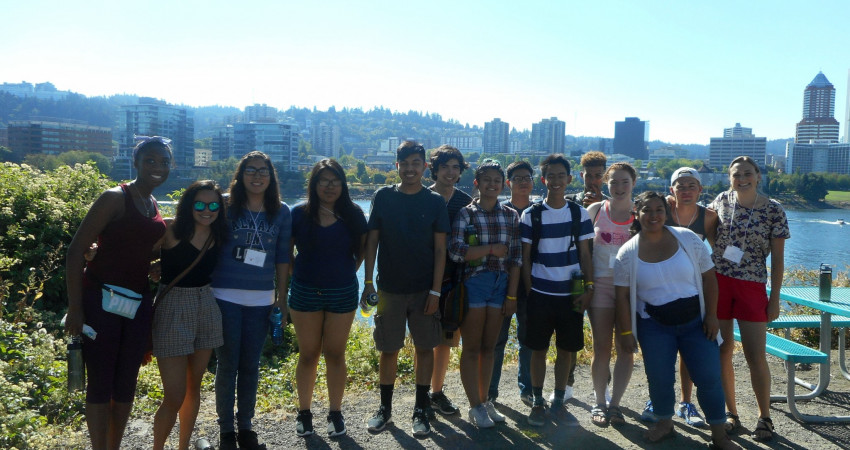 Students enjoy a picnic with a view of Portland.