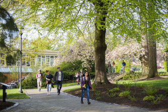 Students walking through LC campus on a spring day.