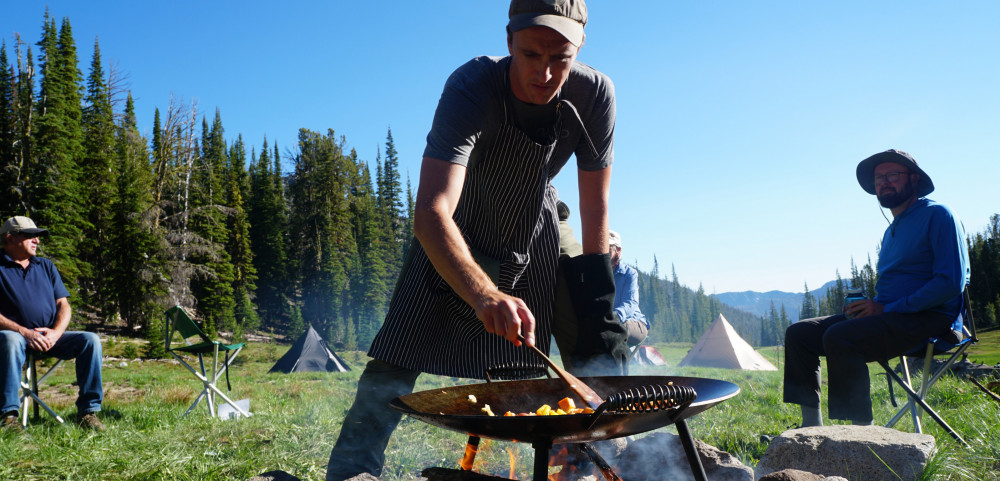 Chef cooking at camp