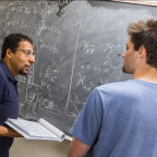 Physics professor Mohamed Anber and physics major Ben Kolligs '18 work through a theoretical phys...