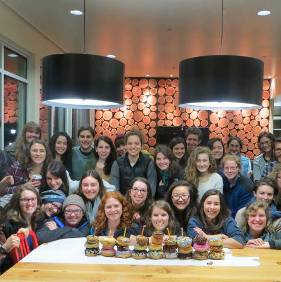 Students celebrate Hannukah on campus with a VooDoo Doughnut menorah.