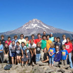 Students and faculty assembled for a group picture on a mountain peak with Mt. Hood in the background. This was only about one-half of th...