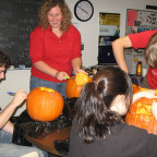 Students carve pumpkins in the Math Sciences Dept. study room.