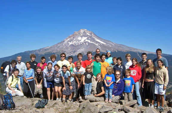 Students and faculty assembled for a group picture on a mountain peak with Mt. Hood in the background. This was only about one-half of th...
